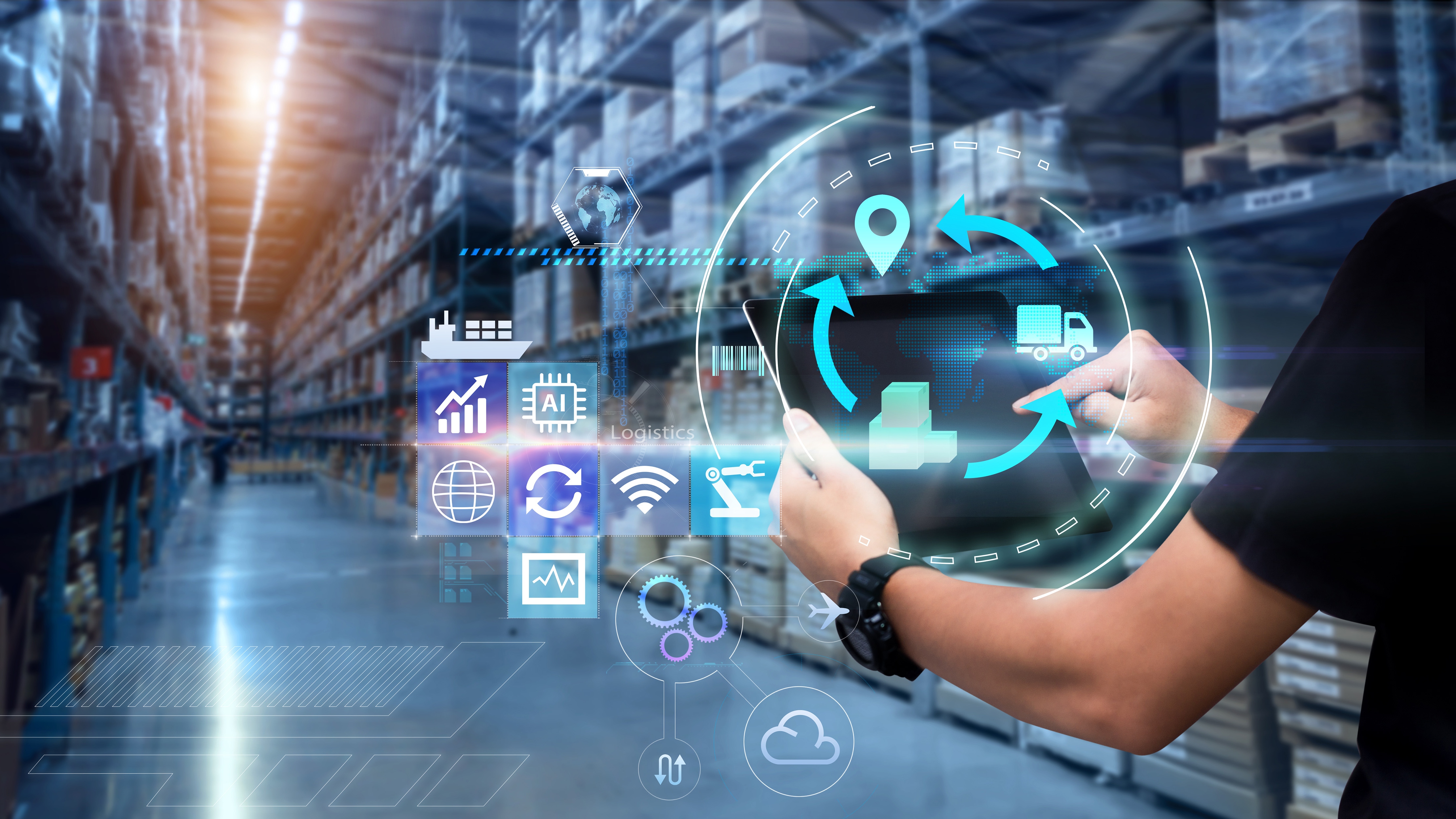 Strategic Alliances Man hands using tablet on blurred warehouse as background